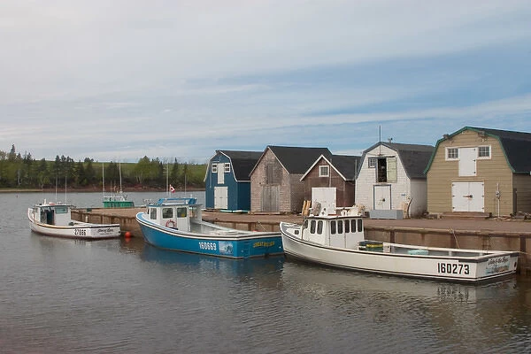 NA, Canada, Prince Edward Island, New London. Fishing sheds and lobster boats in harbour