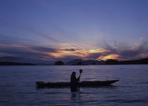 NA, USA, Alaska, Ketchikan. Solo kayaker enjoys sunset (Medium Format)