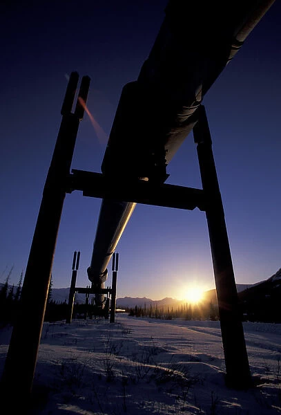 NA, USA, Alaska, north slope of Brooks Range A winter sun sets over the Trans-Alaska