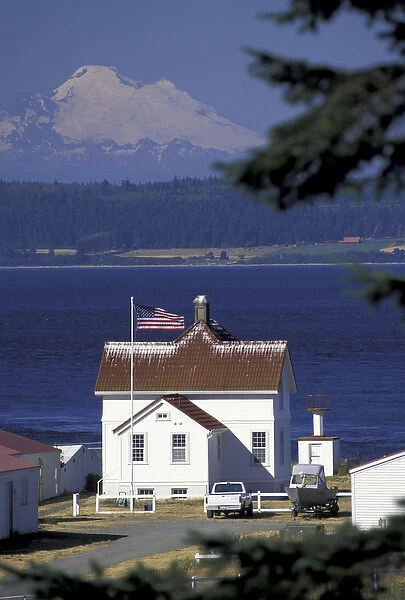 NA, USA, Washington, Marrowstone Island Marrowstone Point lighthouse and Mt. Baker, from Ft