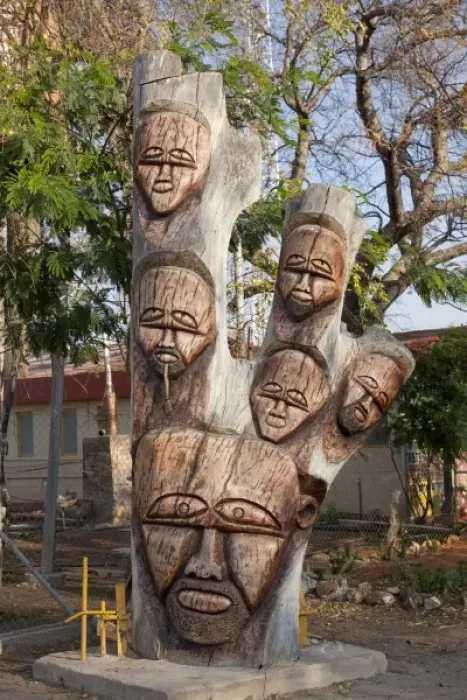 Framed Print : Namibia, Lake Otjikoto. Close-up of wooden carving at the entrance to the lake