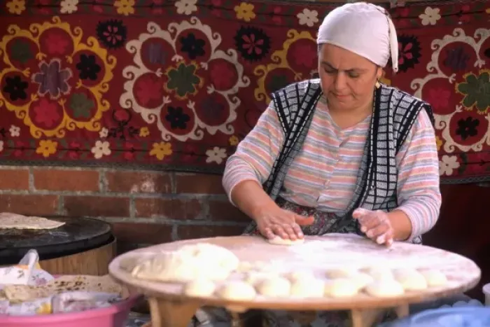 Framed Print : Native woman making bread in Istanbul Turkey (MR)