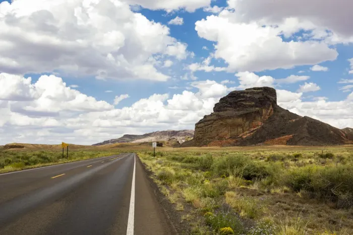 Framed Print : Navajo Nation, Arizona. Back road past a butte Framed Print : Navajo Nation, Arizona. Back road past a butte