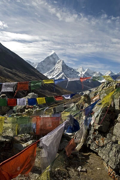 Nepal. Prayer flags are hung along the Everest Base Camp Trail with the peak of Ama