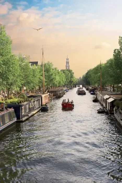 Framed Print : Netherlands, Amsterdam, Boats cruise along a canal with the Zuiderkerk bell-tower in the background Framed Print : Netherlands, Amsterdam, Boats cruise along a canal with the Zuiderkerk bell-tower in the background