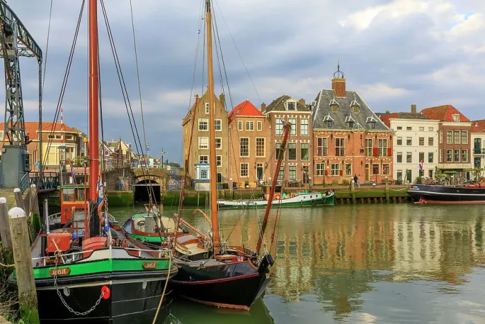 Framed Print : Netherlands, Zuid Holland, Maassluis. Harbor boats and row houses Framed Print : Netherlands, Zuid Holland, Maassluis. Harbor boats and row houses