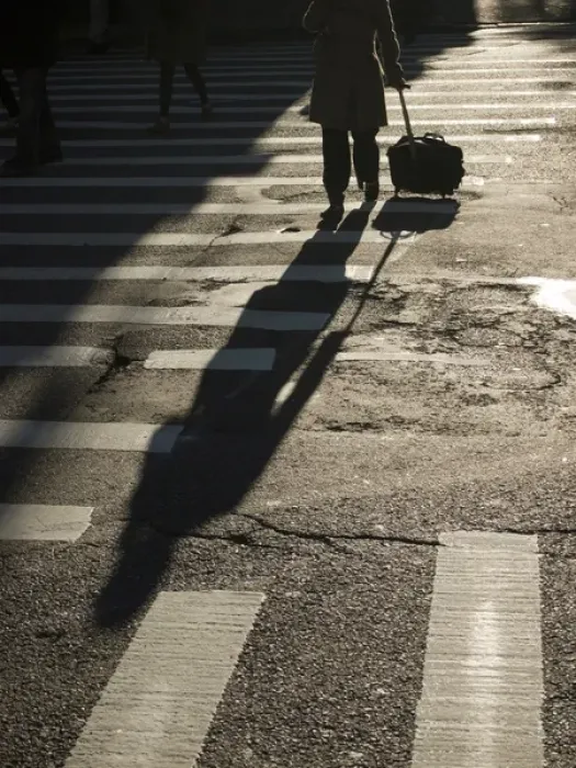 Framed Print : New York, New York, United States A woman rolls her suitcase across a street Framed Print : New York, New York, United States A woman rolls her suitcase across a street