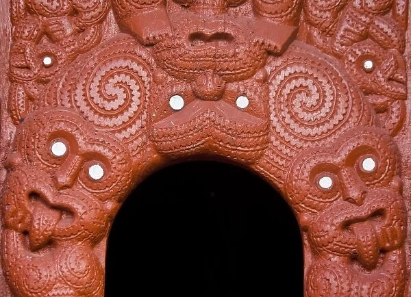 New Zealand, Rotorua. Traditional Maori wood carving around entrance