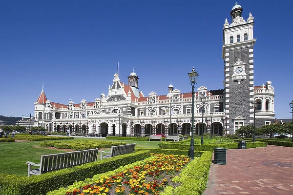 New Zealand, South Island, Dunedin. A park in front of ornate Railroad Station. Credit as