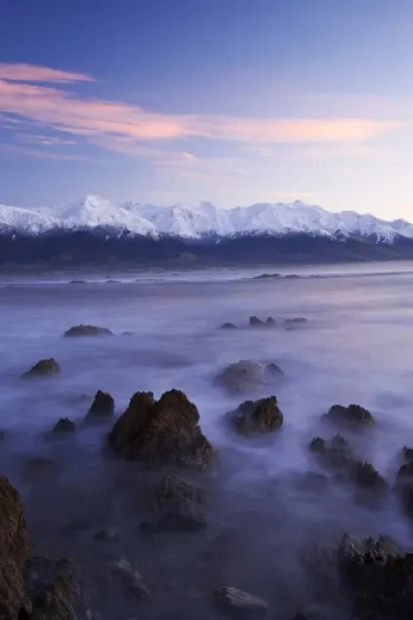 Framed Print : New Zealand, South Island, Kaikoura, Waves on Rocks and Seaward Kaikoura Range at Dawn