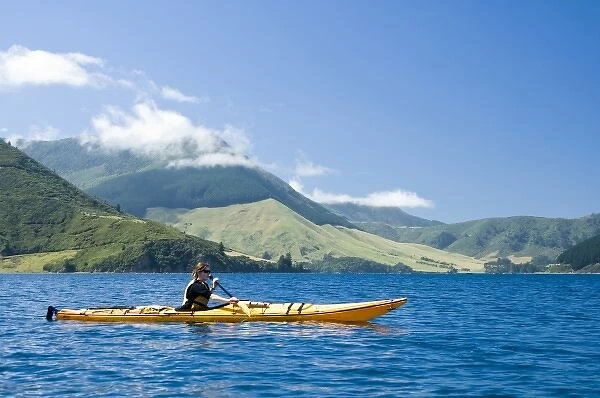 New Zealand, South Island, Marlborough Sounds. Leeann Sain sea kayaking. (MR)
