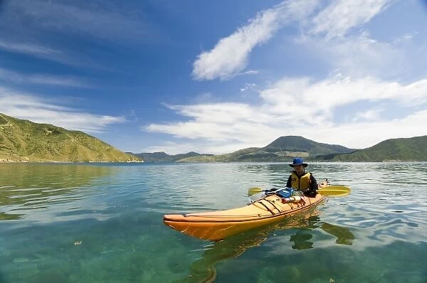 New Zealand, South Island, Marlborough Sounds. Sam Robinson sea kayaking. (MR)
