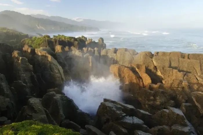 Framed Print : New Zealand, South Island, Paparoa National Park. Water emerging through blowhole at Pankace Rocks