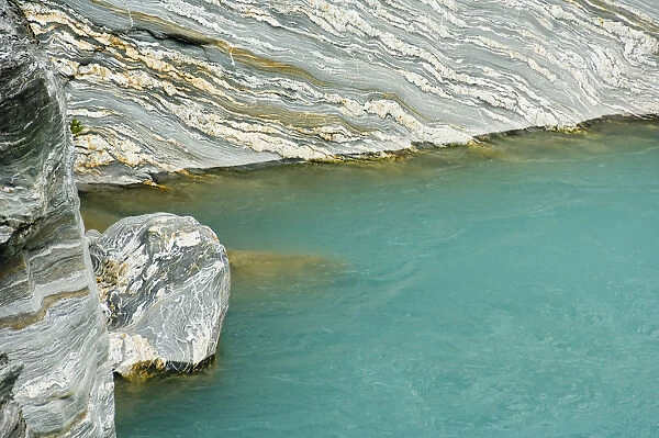 New Zealand, South Island, Westland National Park. Water polished sedimentary rock