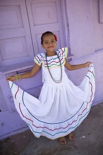 Nicaragua, Granada. Girl in traditional dress after dance in Villa Esperanza barrio. (MR)