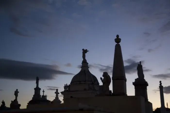 Framed Print : Nicaragua, Granada. Silhouettes of crosses and angels on top of graves in cemetery at sunset Framed Print : Nicaragua, Granada. Silhouettes of crosses and angels on top of graves in cemetery at sunset