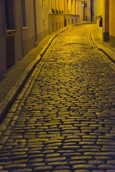 Night view of cobblestone street in the old town, Riga, Latvia