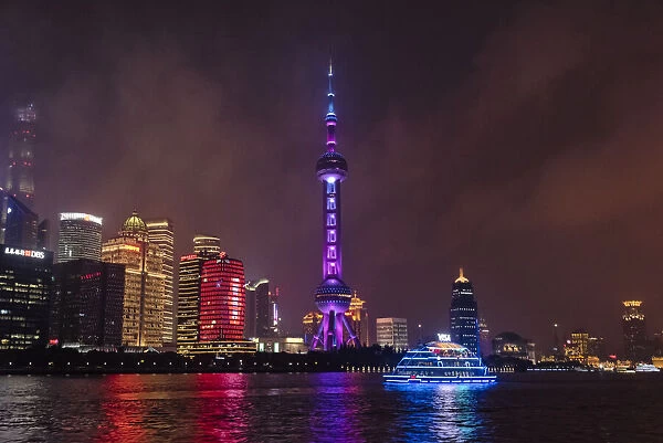Night view of Oriental Pearl TV Tower and high-rises by Huangpu River, Pudong, Shanghai