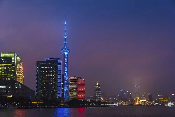Night view of Oriental Pearl TV Tower and high-rises by Huangpu River, Pudong, Shanghai