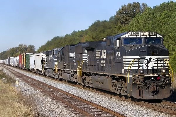 Norfolk Southern Railway locomotive traveling along Highway 72 west of Mussel Shoals, Alabama, USA