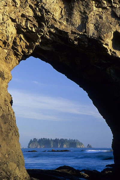 North Amercia, Washington, island viewed through arch in sea stack, Rialto Beach