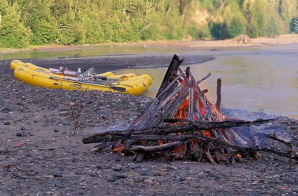 North America, Canada, British Columbia, Taku River Region. Camp fire with rafts