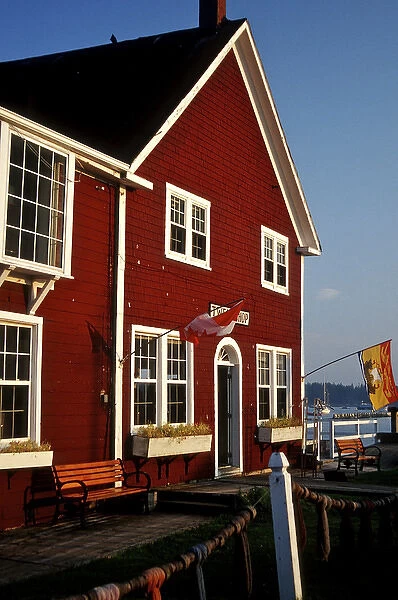 North America, Canada, New Brunswick, St Andrews. A bright red building on the harbor