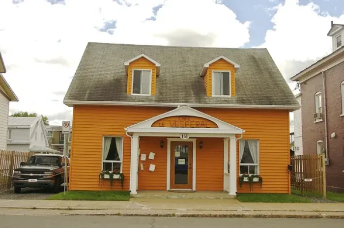 Framed Print : North America, Canada, Quebec, Mauricie, Grand-Mere. A bright orange cafe