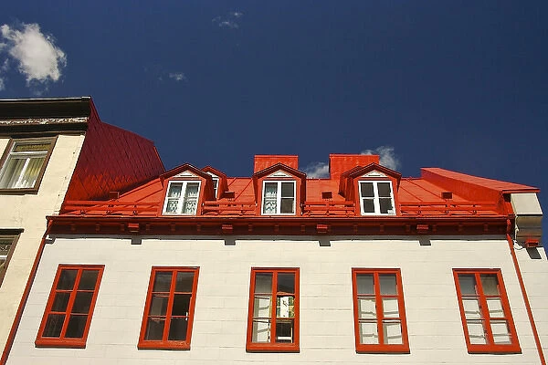 North America, Canada, Quebec, Old Quebec City. Upper windows and red roof of a building