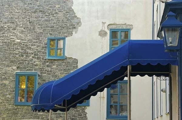 North America, Canada, Quebec, Old Quebec City. Blue awning and trim, and a wall of stucco