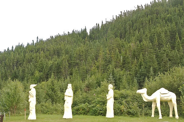 North America, Canada, Quebec, Saguenay, Riviere-Eternite. Figures near a sign announcing
