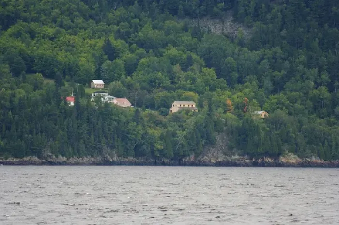 Framed Print : North America, Canada, Quebec, Saguenay. View from the water of houses amongst trees