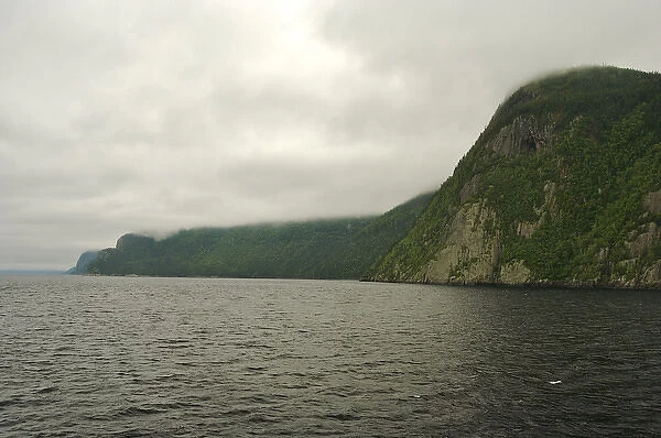 North America, Canada, Quebec, Saguenay. View from the water of Saguenay Fjord cliffs