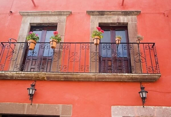 North America, Central Mexico, Guanajuato state, San Miguel de Allende. Window with flower pots