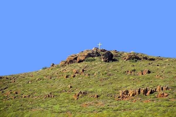 North America; Mexico; Baja California; Ensenada. A lone cross tops a hill among