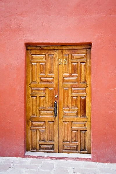 North America, Mexico, Guanajuato state, San Miguel. A carved wooden door in San Miguel