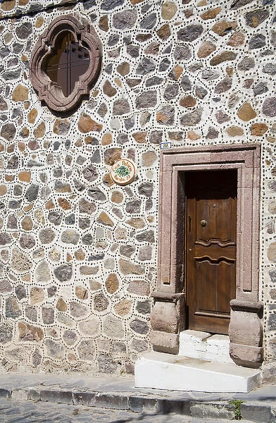 North America, Mexico, Guanajuato state, San Miguel. An unusual stone wall and entrance