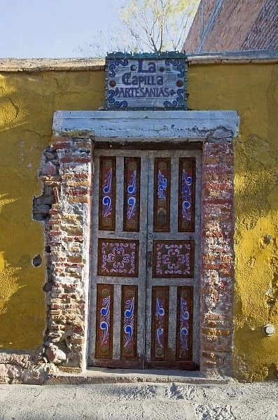 North America, Mexico, Guanajuato state, San Miguel. A hand painted door to an artesanias