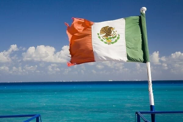 North America, Mexico, Quintana Roo, Cozumel. The Mexican flag flying off the stern