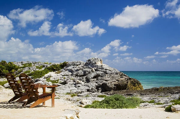 North America, Mexico, Quintana Roo, Tulum. Chairs overlooking the Caribbean Sea