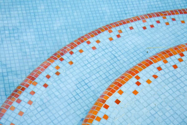 North America, Mexico, Yucatan, Merida. Tile steps leading into the swimming pool