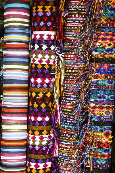 North America, Mexico, Yucatan, Merida. Woven bracelets on bolts for sale in a shop