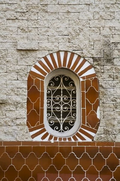 North America, Mexico, Yucatan, Merida. Tile work on the exterior of a brick building