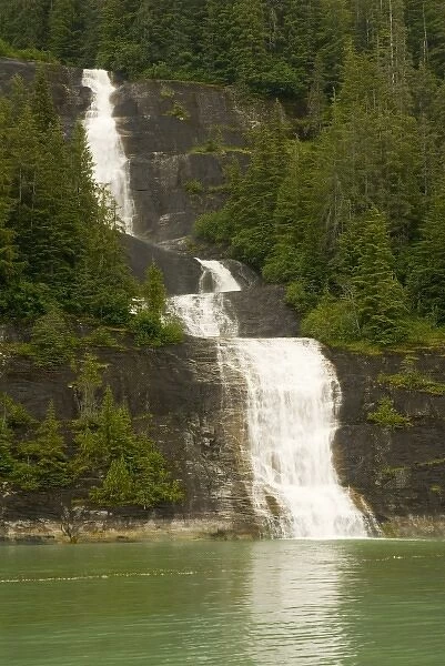 North America, USA, AK, Inside Passage. Waterfall through forest cascades down cliff