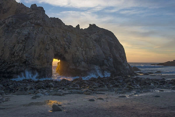 North America, USA, California. Last light through the arch at Pfeiffer Big Sur State Park