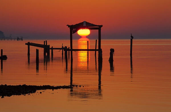 North America; USA; Florida; Apalachicola; Sunrise at an old boat house at Apalachicola