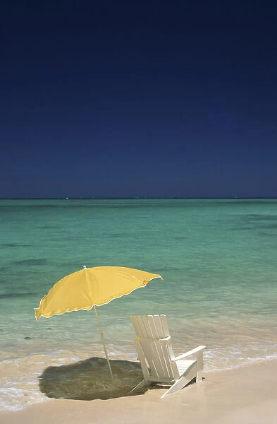 North America, USA, Hawaii. Beach chair and umbrella