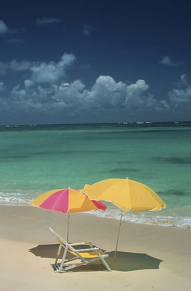 North America, USA, Hawaii. Beach chair and umbrellas