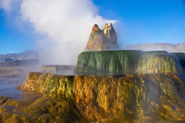 North America, USA, Nevada, Black Rock Desert, Fly Geyser, Erupting framed by Granite