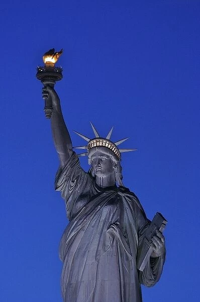 North America, USA, New York, New York City. The Statue of Liberty in the evening